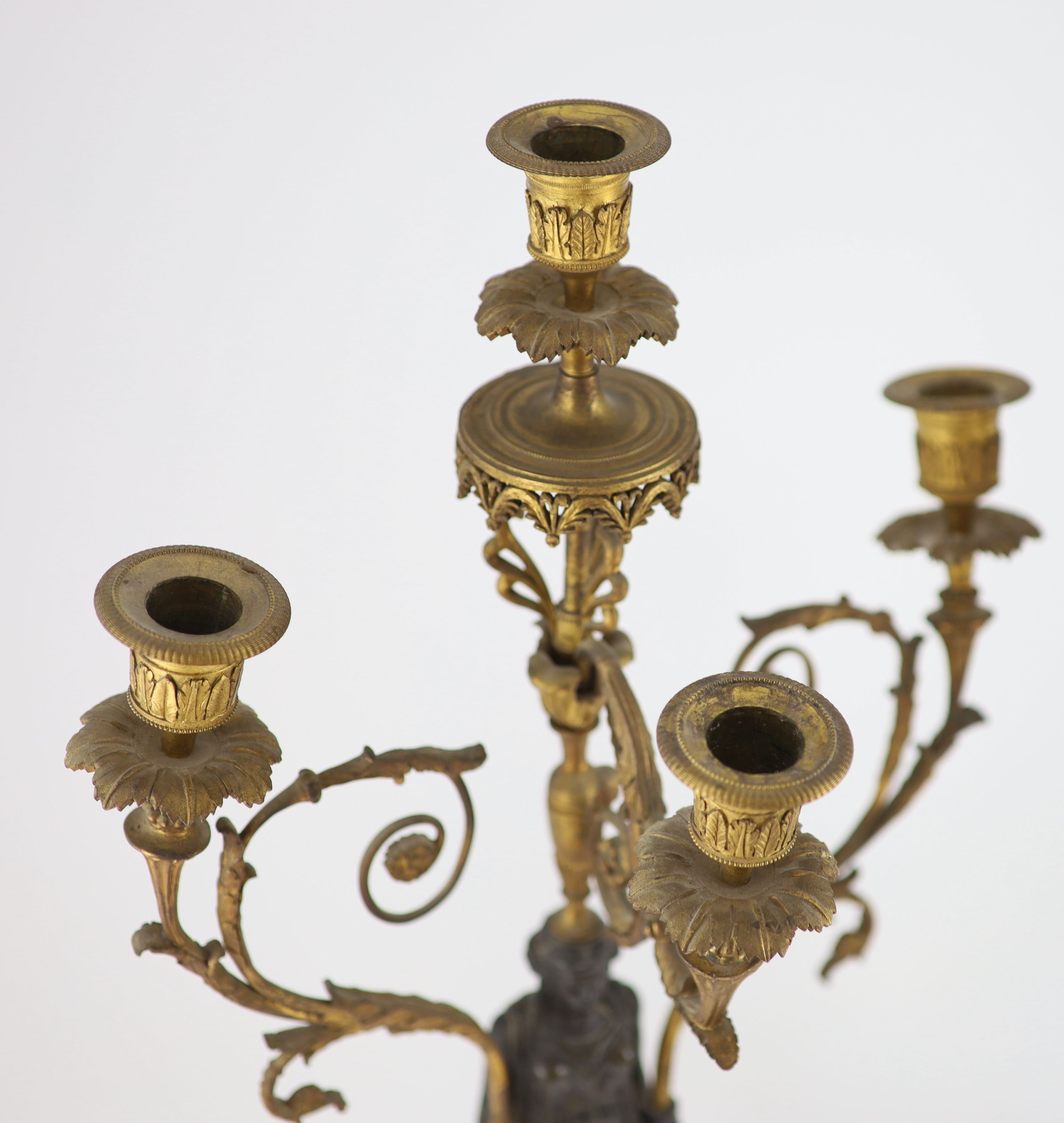 A pair of 19th-century French bronze and ormolu candelabra H 68cm. W 32cm.